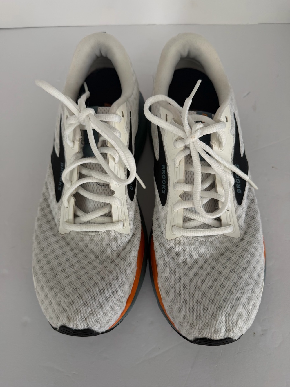 Brooks Men’s White Running Shoes with Black and Orange Accents